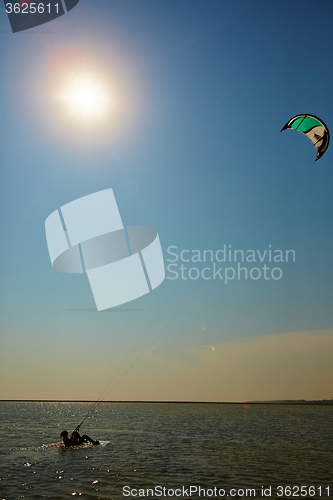 Image of young woman kite-surfer