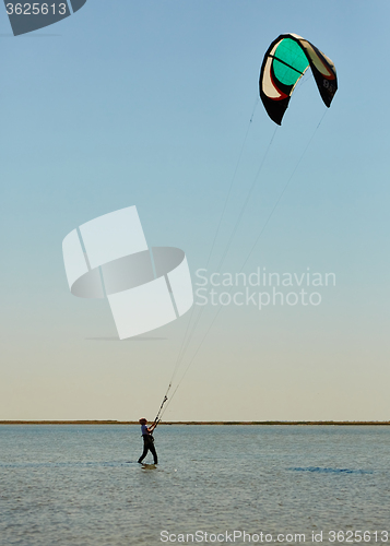 Image of young woman kite-surfer