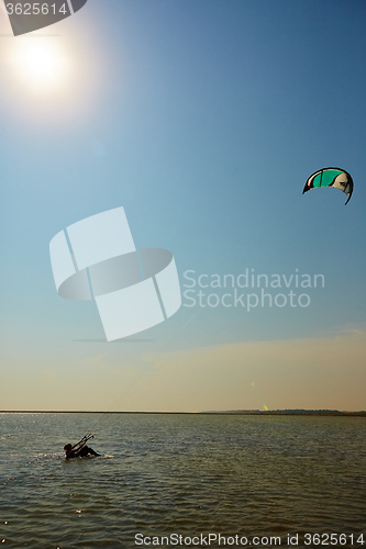 Image of young woman kite-surfer