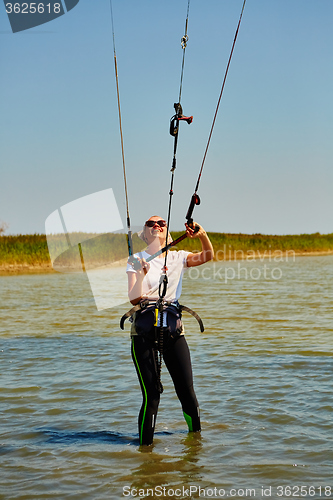 Image of young woman kite-surfer