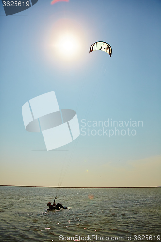 Image of young woman kite-surfer