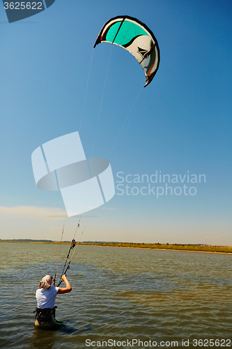 Image of young woman kite-surfer