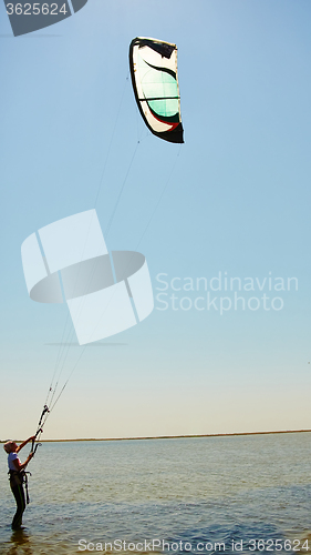 Image of young woman kite-surfer