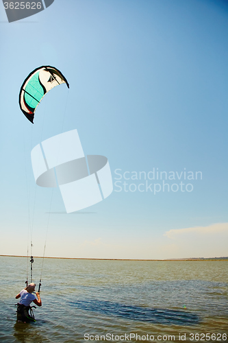 Image of young woman kite-surfer