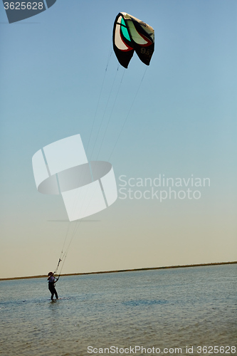 Image of young woman kite-surfer