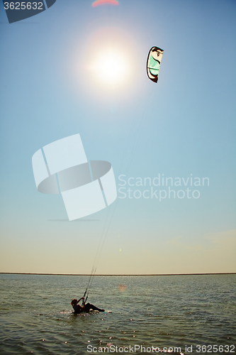 Image of young woman kite-surfer