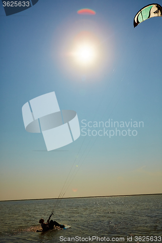 Image of young woman kite-surfer