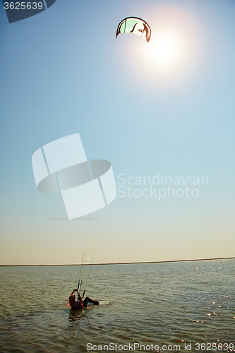 Image of young woman kite-surfer