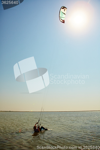 Image of young woman kite-surfer