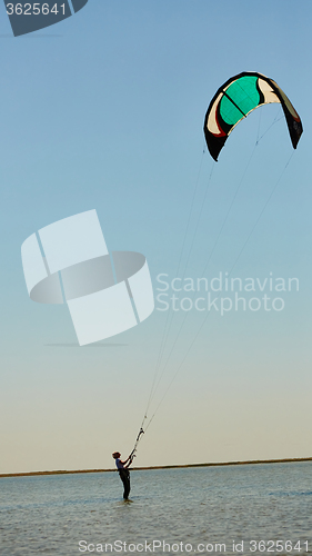 Image of young woman kite-surfer