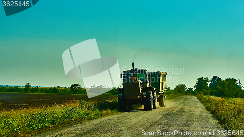 Image of Tractor on the road with trailer