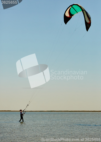 Image of young woman kite-surfer