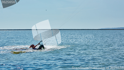 Image of young woman kite-surfer