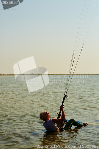 Image of young woman kite-surfer