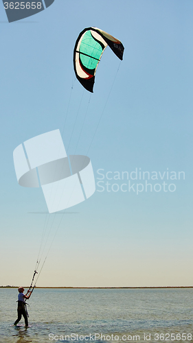 Image of young woman kite-surfer