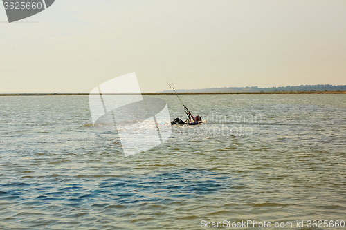 Image of young woman kite-surfer