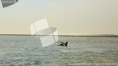 Image of young woman kite-surfer