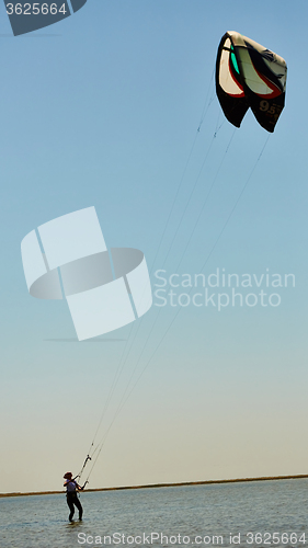 Image of young woman kite-surfer