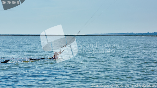 Image of young woman kite-surfer