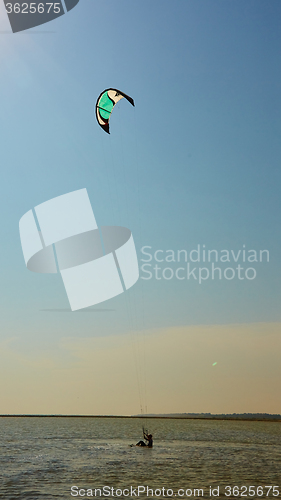 Image of young woman kite-surfer