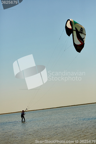 Image of young woman kite-surfer