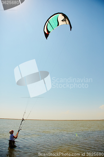 Image of young woman kite-surfer