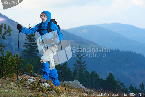 Image of advanture man with backpack hiking