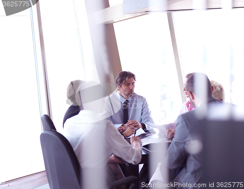 Image of business people group on meeting at bright modern office
