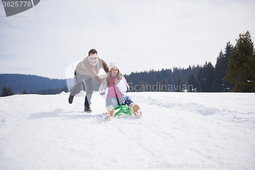 Image of happy young couple having fun on fresh show on winter vacation