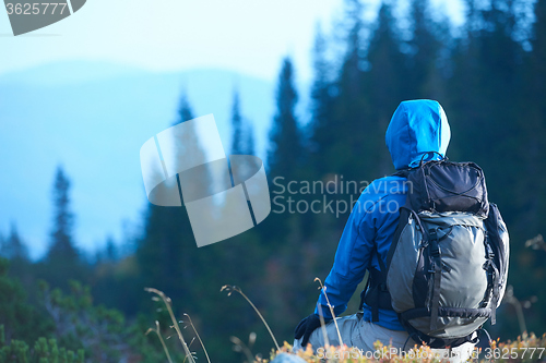 Image of advanture man with backpack hiking