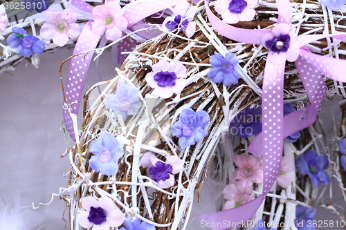 Image of spring violet plastic flowers decoration