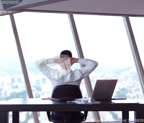 Image of young business man at office