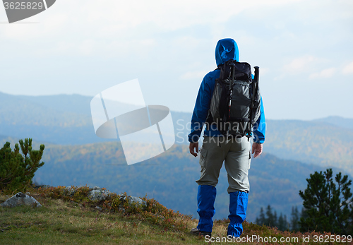 Image of advanture man with backpack hiking