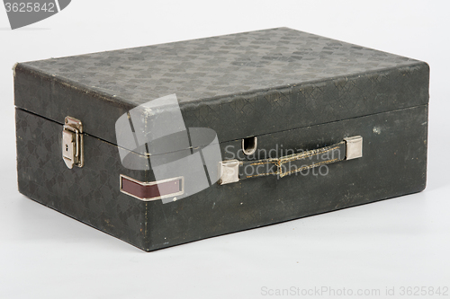 Image of Old suitcase with gramophone inside isolated on a white background