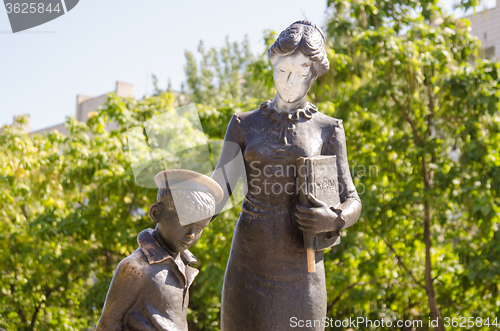 Image of Vandals painted over with white paint face first teacher, a monument to the first teacher Volgograd