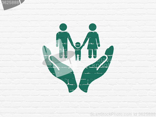 Image of Insurance concept: Family And Palm on wall background