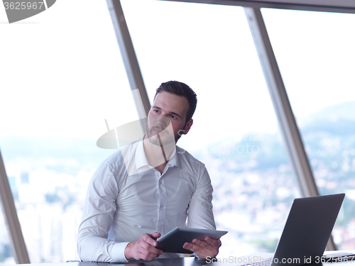 Image of young business man at office