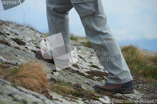 Image of hiking man with trekking boots