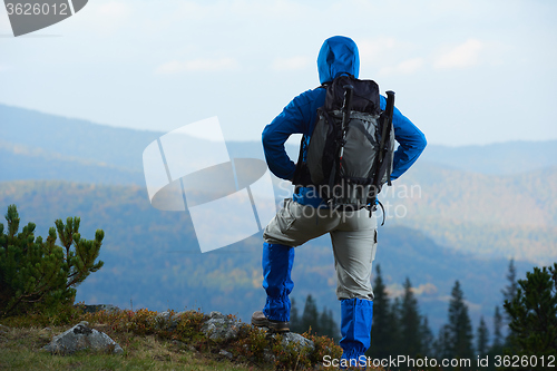 Image of advanture man with backpack hiking