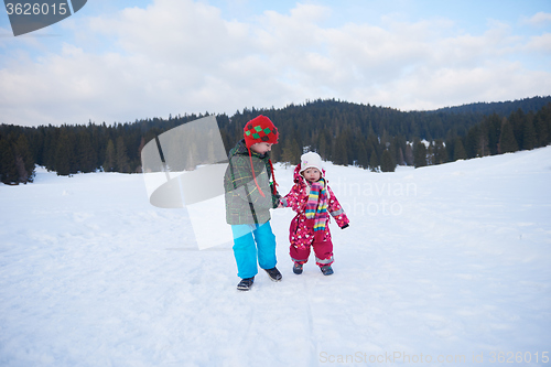 Image of kids walking on snow