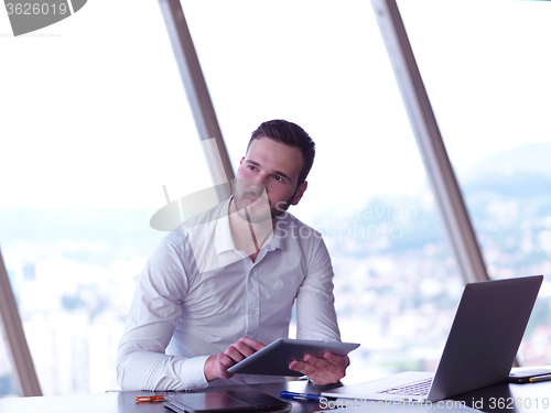 Image of young business man at office