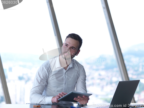 Image of young business man at office