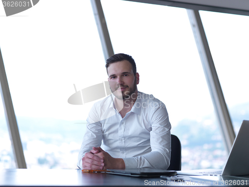 Image of young business man at office