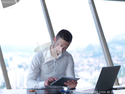 Image of young business man at office