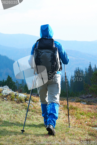 Image of advanture man with backpack hiking