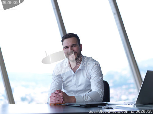 Image of young business man at office