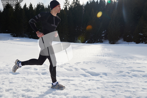 Image of jogging on snow in forest