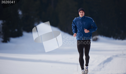 Image of jogging on snow in forest