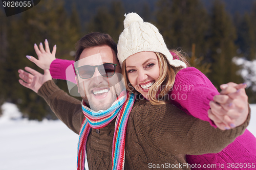 Image of romantic young couple on winter vacation