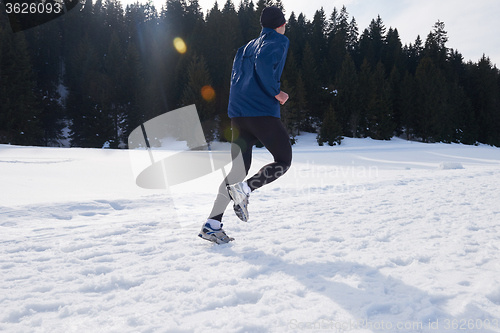 Image of jogging on snow in forest